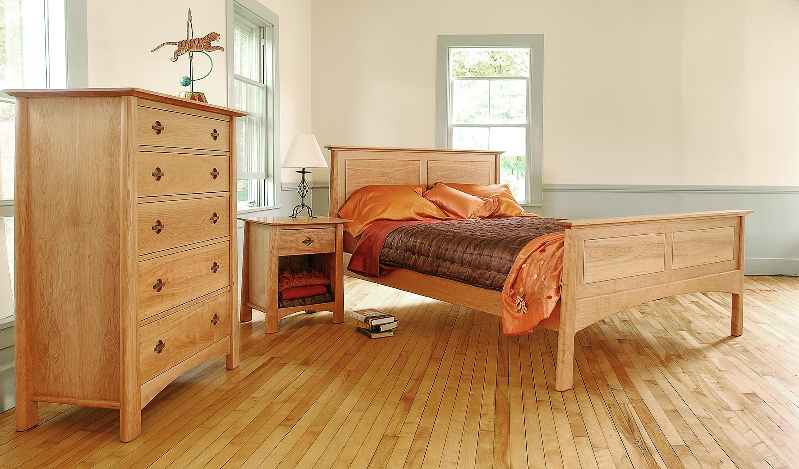 Harvestmoon Panel Bed in cherry with matching chest and nightstand from Maple Corner Woodworks